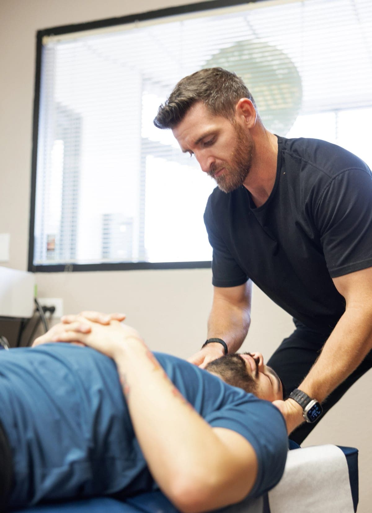 Dr. Brennan setting up a cervical adjustment on a patient